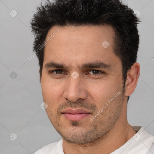 Joyful white adult male with short  brown hair and brown eyes