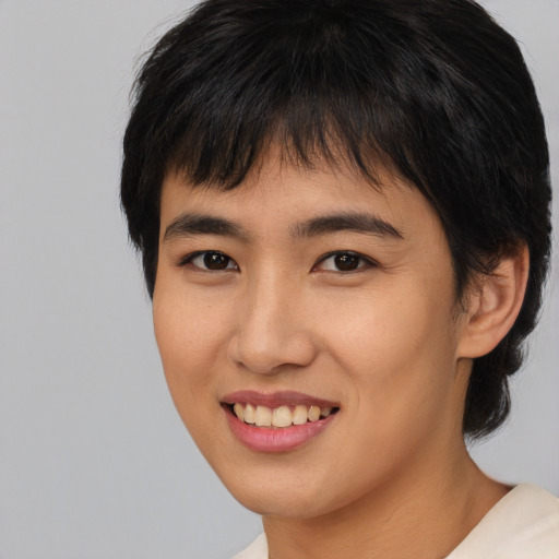 Joyful asian young-adult female with medium  brown hair and brown eyes