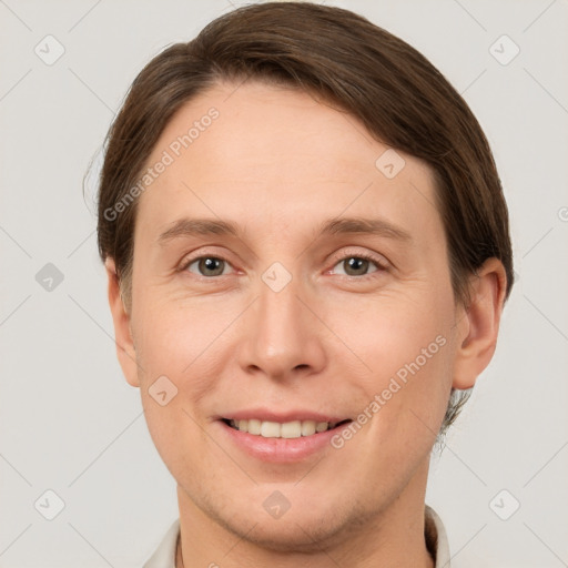 Joyful white young-adult female with short  brown hair and grey eyes