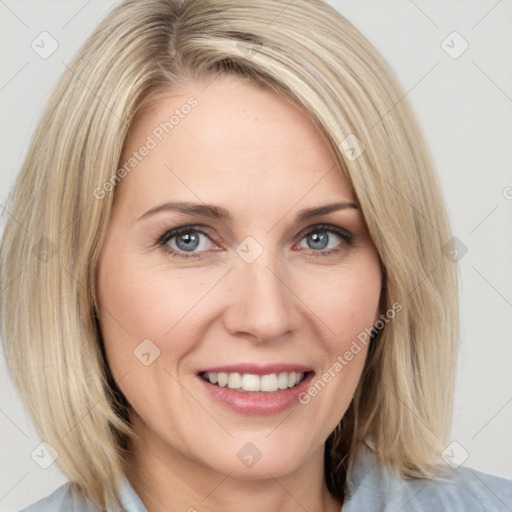 Joyful white young-adult female with medium  brown hair and blue eyes