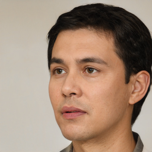 Neutral white young-adult male with short  black hair and brown eyes