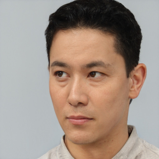 Neutral asian young-adult male with short  black hair and brown eyes