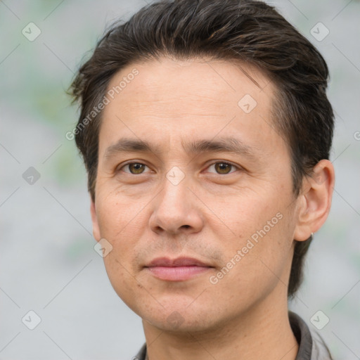 Joyful white adult male with short  brown hair and brown eyes