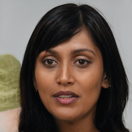 Joyful asian young-adult female with long  black hair and brown eyes