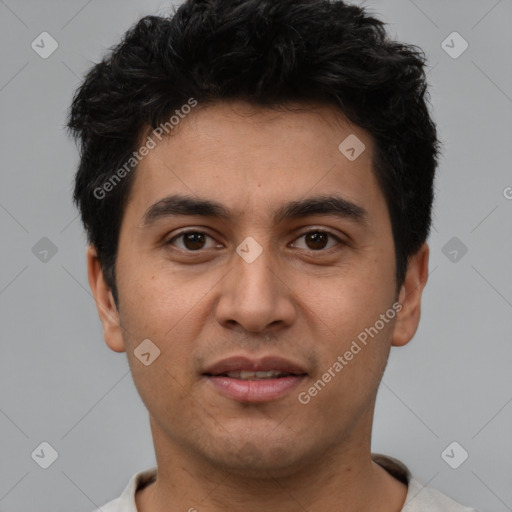 Joyful white young-adult male with short  black hair and brown eyes