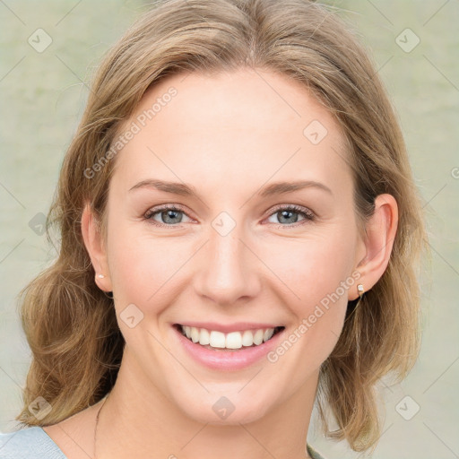 Joyful white young-adult female with medium  brown hair and green eyes