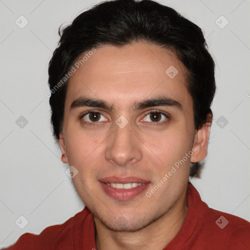 Joyful white young-adult male with short  black hair and brown eyes