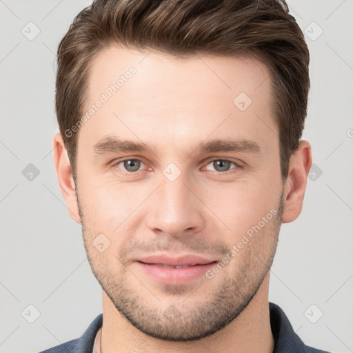 Joyful white young-adult male with short  brown hair and brown eyes