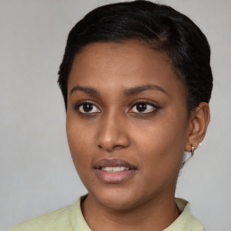 Joyful latino young-adult female with short  brown hair and brown eyes