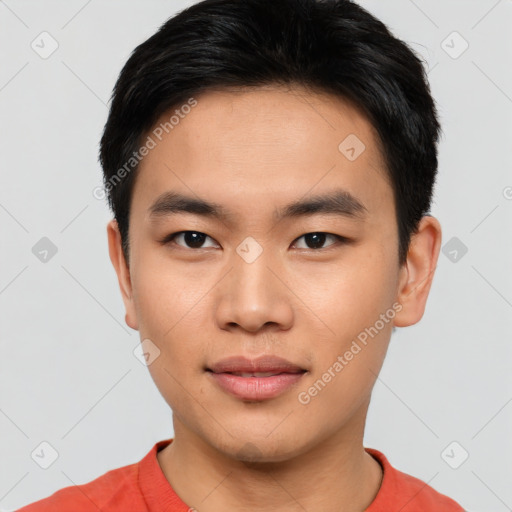 Joyful asian young-adult male with short  black hair and brown eyes