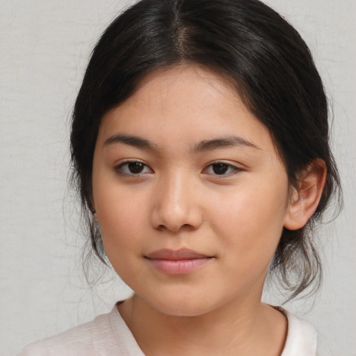 Joyful asian young-adult female with medium  black hair and brown eyes