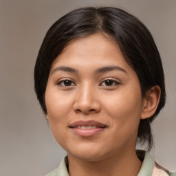 Joyful asian young-adult female with medium  brown hair and brown eyes