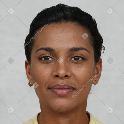 Joyful black young-adult female with short  brown hair and brown eyes