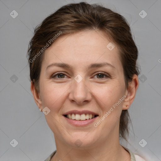 Joyful white adult female with medium  brown hair and grey eyes