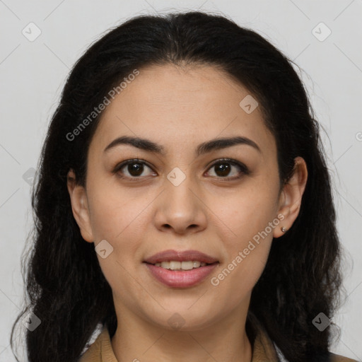 Joyful latino young-adult female with long  brown hair and brown eyes