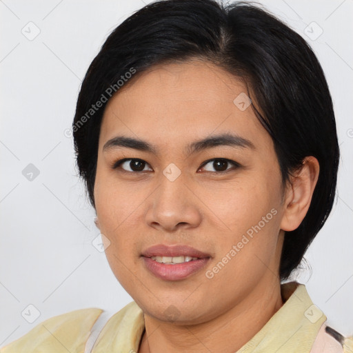 Joyful asian young-adult female with short  brown hair and brown eyes