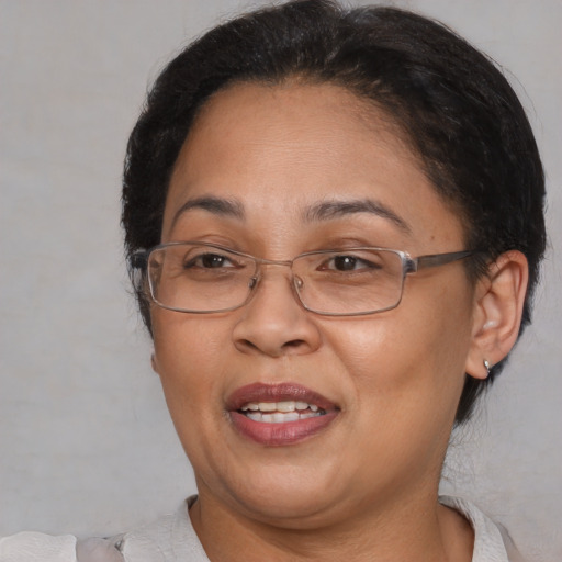 Joyful asian adult female with short  brown hair and brown eyes