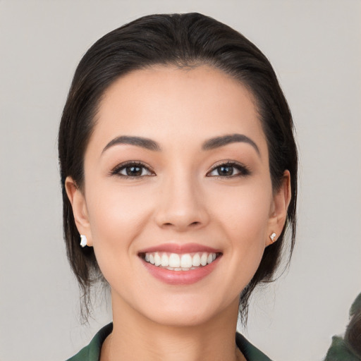 Joyful white young-adult female with medium  brown hair and brown eyes