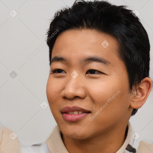 Joyful asian young-adult male with short  black hair and brown eyes