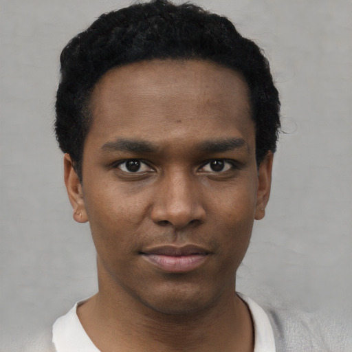 Neutral black young-adult male with short  black hair and brown eyes
