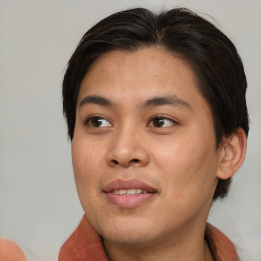 Joyful asian young-adult female with medium  brown hair and brown eyes