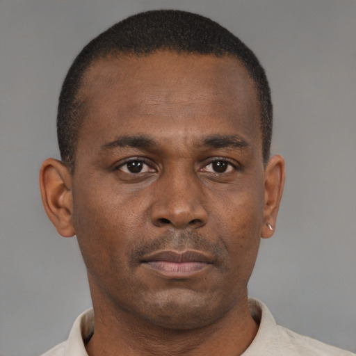 Neutral black young-adult male with short  black hair and brown eyes