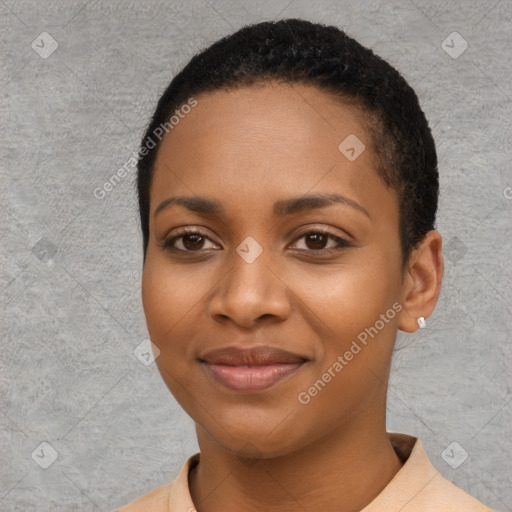 Joyful black young-adult female with short  black hair and brown eyes