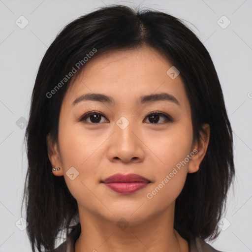 Joyful asian young-adult female with medium  brown hair and brown eyes