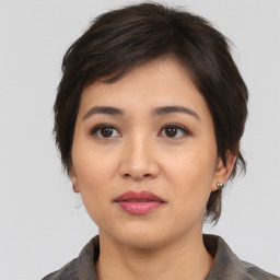 Neutral asian young-adult female with medium  brown hair and brown eyes