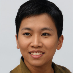 Joyful asian young-adult female with short  black hair and brown eyes