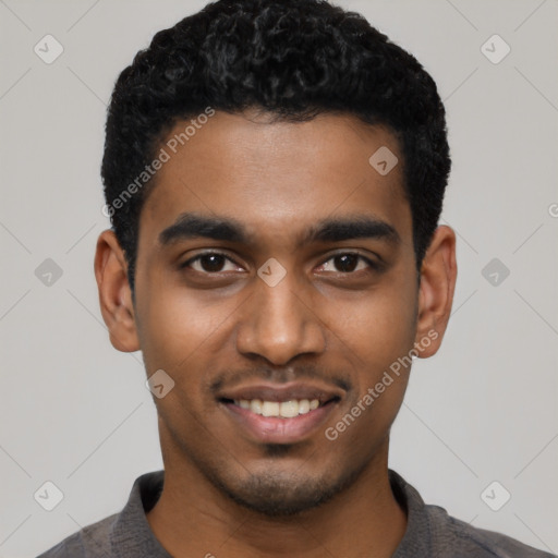 Joyful black young-adult male with short  black hair and brown eyes