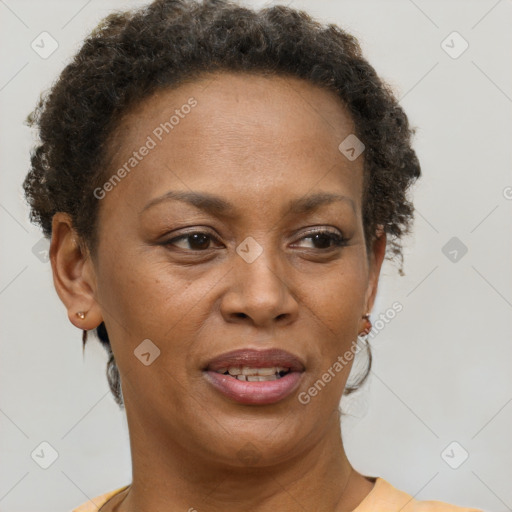 Joyful black adult female with short  brown hair and brown eyes