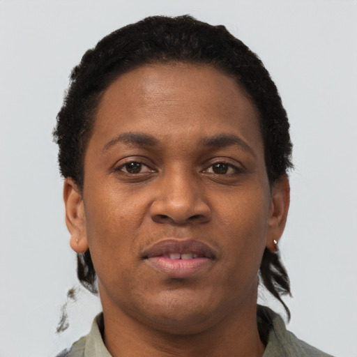 Joyful black young-adult female with short  brown hair and brown eyes