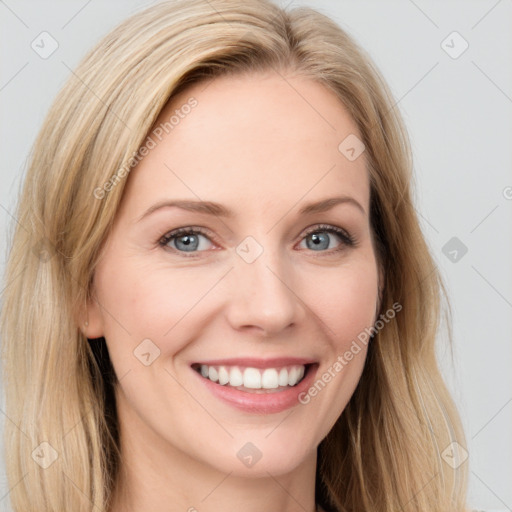 Joyful white young-adult female with long  brown hair and blue eyes