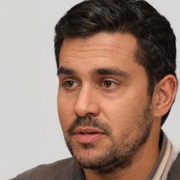 Neutral white adult male with short  black hair and brown eyes