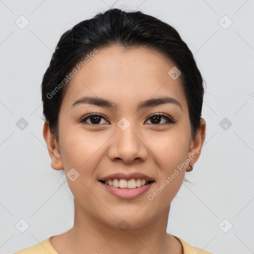 Joyful latino young-adult female with short  brown hair and brown eyes