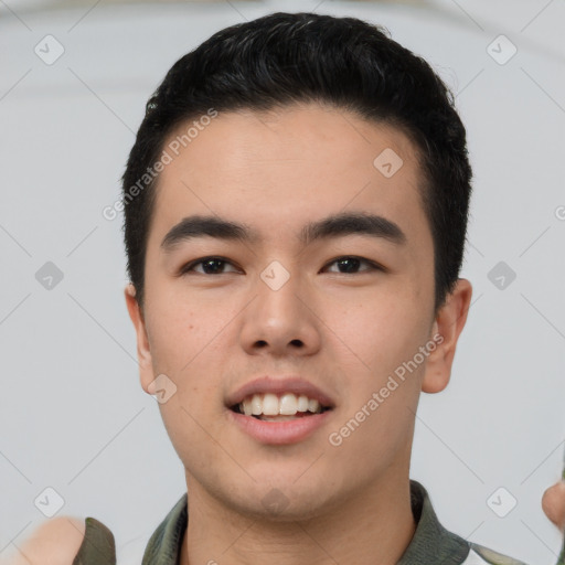 Joyful asian young-adult male with short  black hair and brown eyes