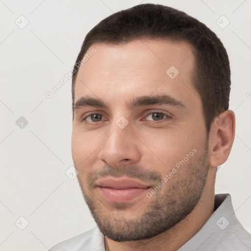 Joyful white young-adult male with short  black hair and brown eyes