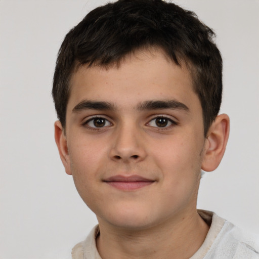 Joyful white child male with short  brown hair and brown eyes