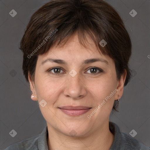 Joyful white adult female with medium  brown hair and brown eyes