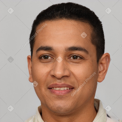 Joyful latino young-adult male with short  brown hair and brown eyes