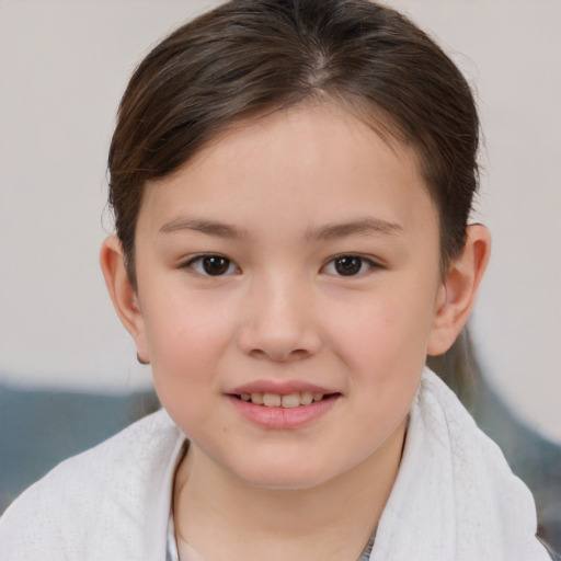Joyful white child female with short  brown hair and brown eyes