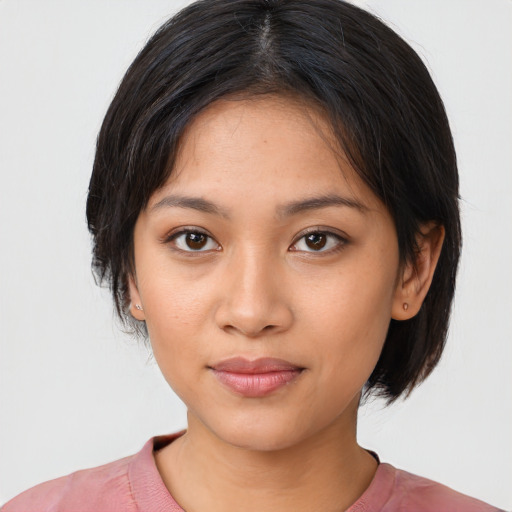 Joyful asian young-adult female with medium  black hair and brown eyes
