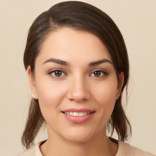 Joyful white young-adult female with medium  brown hair and brown eyes