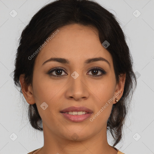 Joyful latino young-adult female with medium  brown hair and brown eyes