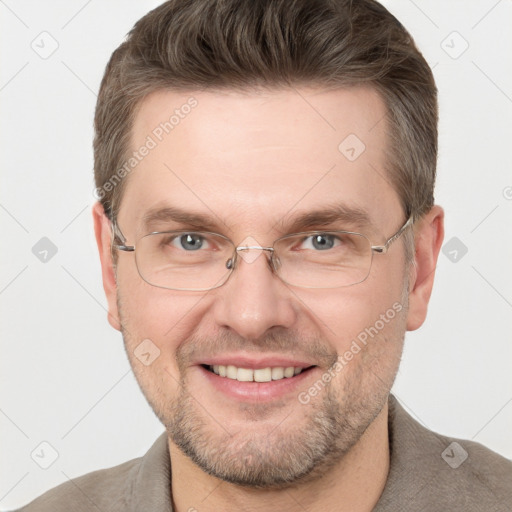 Joyful white adult male with short  brown hair and grey eyes