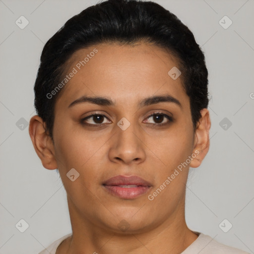 Joyful latino young-adult female with short  black hair and brown eyes