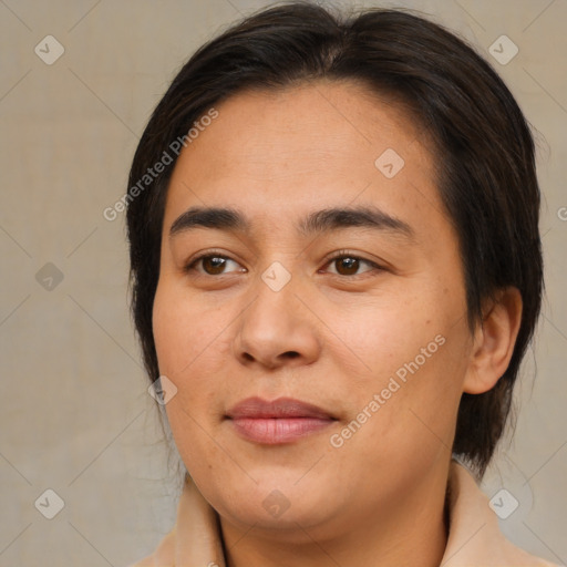 Joyful asian adult female with medium  brown hair and brown eyes