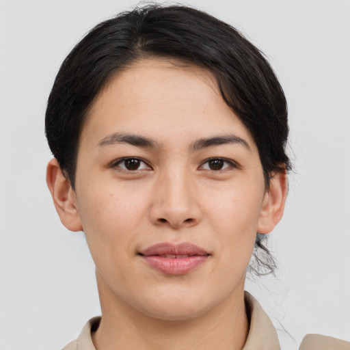 Joyful asian young-adult female with medium  brown hair and brown eyes