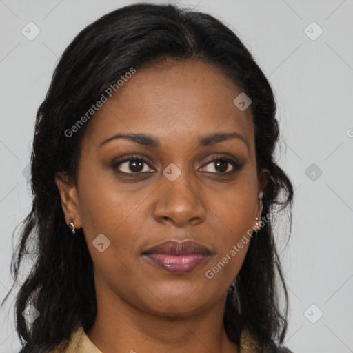 Joyful black young-adult female with long  brown hair and brown eyes